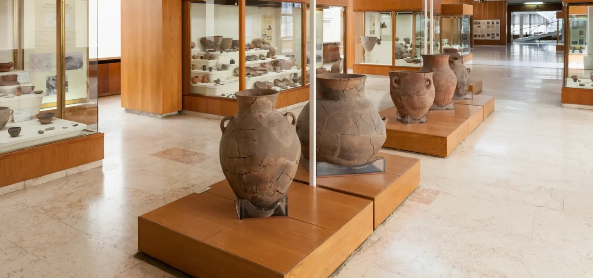 Secure museum artifact storage cabinet with high-density shelving.